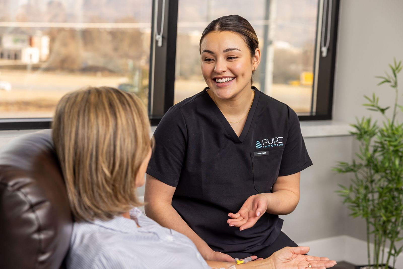 A Pure Infusion nurse talking with a patient